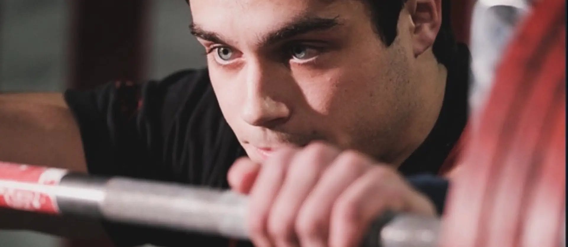Close-up of athlete preparing for barbell lift at Mach 1 Barbell