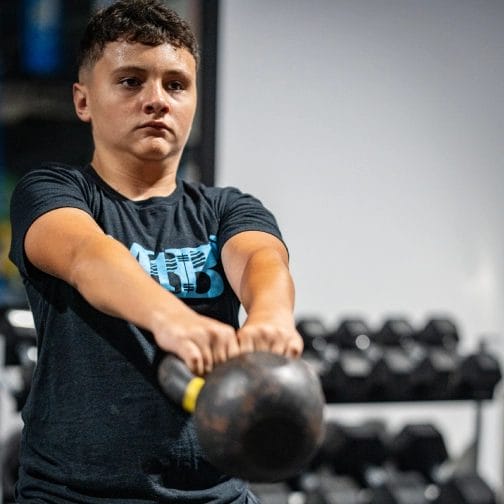 Building Strong Foundations: The Power of Resistance Training for Youth Athletes 4 Kid with barbell at Mach 1 Barbell